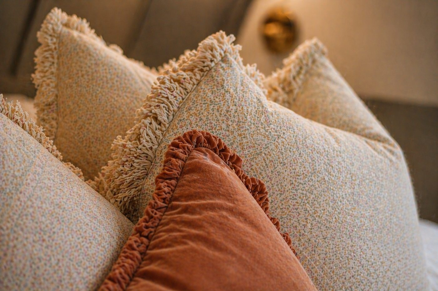 Hand-selected pillows with velvet and fringe detail
